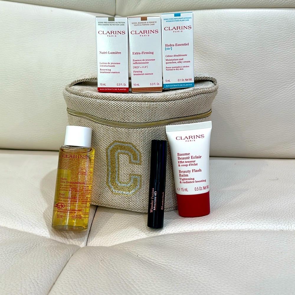 Clarins 6 Piece Set including Full Size Lipstick and Cosmetic Bag are Brand New
